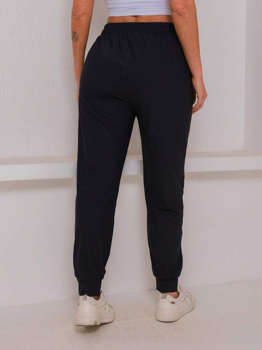 Calça Esportiva Feminina com Elastano – Liberdade e Conforto para Seus Treinos